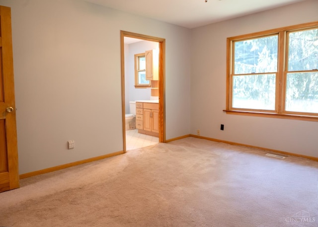 945 Lazenby Rd, Washington Twp, OH 45148 - unfurnished bedroom featuring light carpet and ensuite bathroom