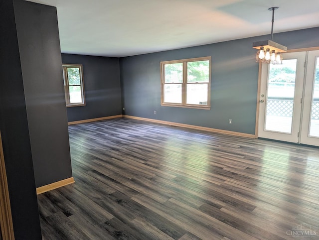 945 Lazenby Rd, Washington Twp, OH 45148 - empty room with plenty of natural light, dark wood-type flooring, and a chandelier