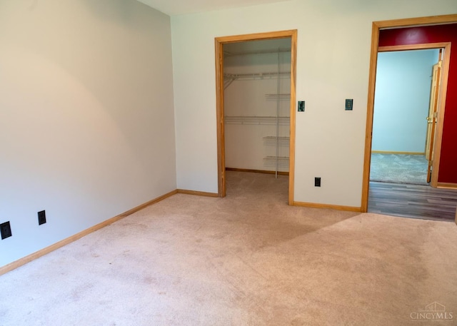 945 Lazenby Rd, Washington Twp, OH 45148 - unfurnished bedroom featuring carpet, a walk in closet, a closet, and radiator