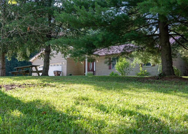 945 Lazenby Rd, Washington Twp, OH 45148 - view of front of home with a garage and a front lawn