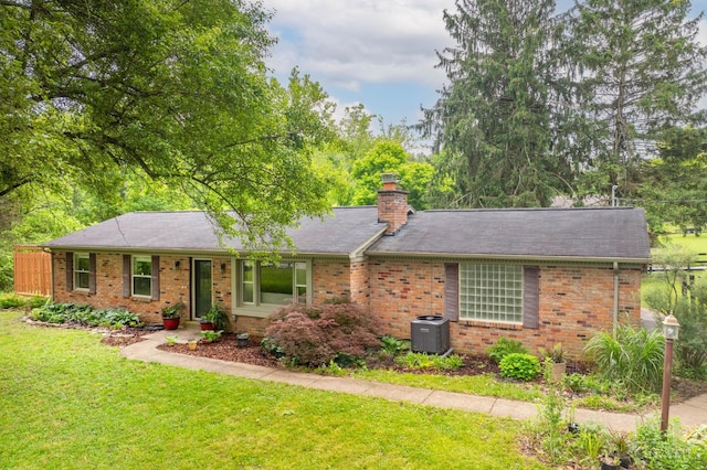 8385 Bridle Rd, Anderson Twp, OH 45244 - ranch-style house featuring a front lawn, brick siding, and a chimney