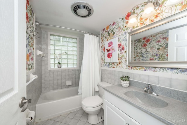 8385 Bridle Rd, Anderson Twp, OH 45244 - bathroom with tile patterned floors, vanity, shower / bath combo with shower curtain, tile walls, and wallpapered walls