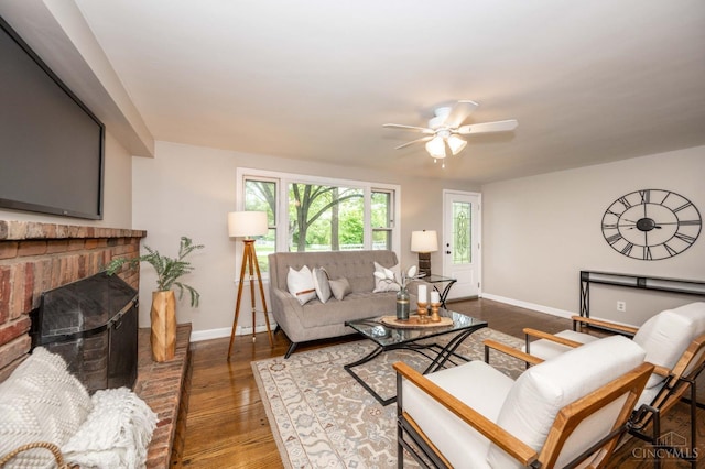 8385 Bridle Rd, Anderson Twp, OH 45244 - living area with ceiling fan, wood finished floors, and a fireplace