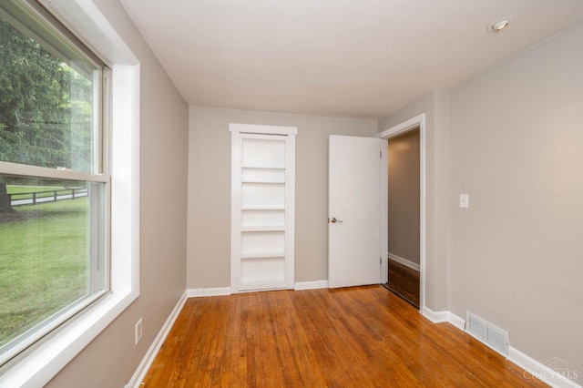 8385 Bridle Rd, Anderson Twp, OH 45244 - spare room with wood finished floors and built in features
