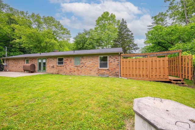 8385 Bridle Rd, Anderson Twp, OH 45244 - back of property with heating fuel, a patio area, and brick siding
