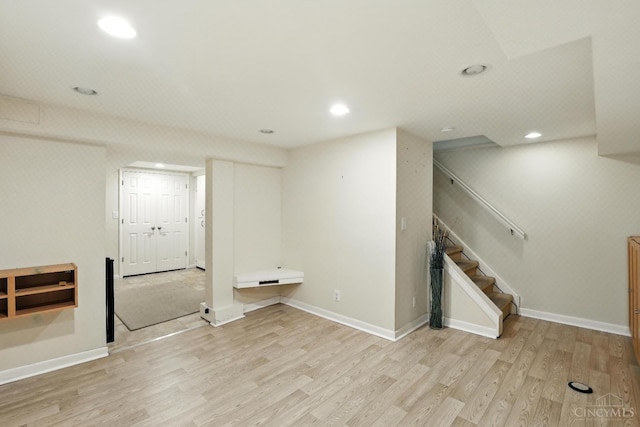 1006 Harbury Dr, Springfield Twp, OH 45224 - finished below grade area featuring wood finished floors, stairs, and recessed lighting