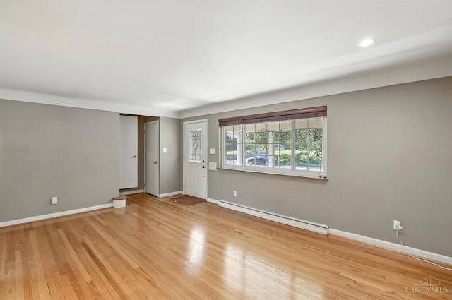 1006 Harbury Dr, Springfield Twp, OH 45224 - spare room with baseboard heating and light wood finished floors