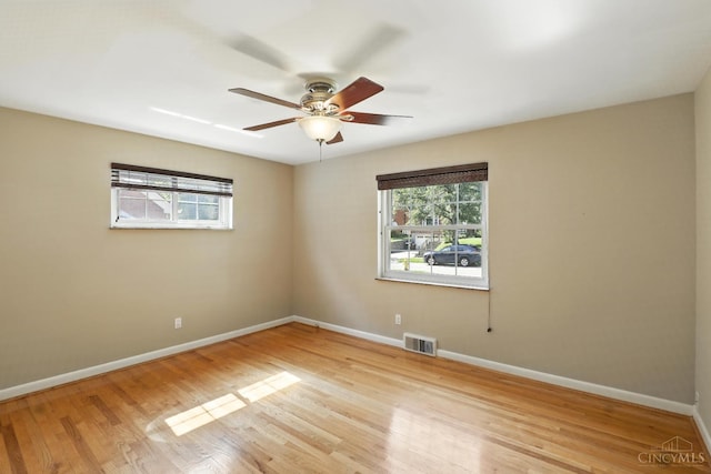 1006 Harbury Dr, Springfield Twp, OH 45224 - unfurnished room featuring plenty of natural light, light wood-type flooring, and ceiling fan