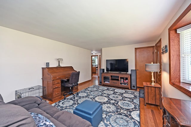 3638 El Rego Dr, Pierce Twp, OH 45102 - living room featuring wood finished floors, plenty of natural light, and an office area