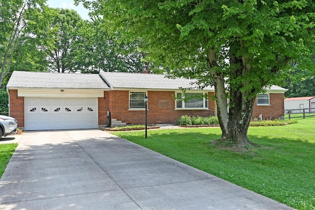 3638 El Rego Dr, Pierce Twp, OH 45102 - ranch-style home featuring brick siding, driveway, an attached garage, and a chimney