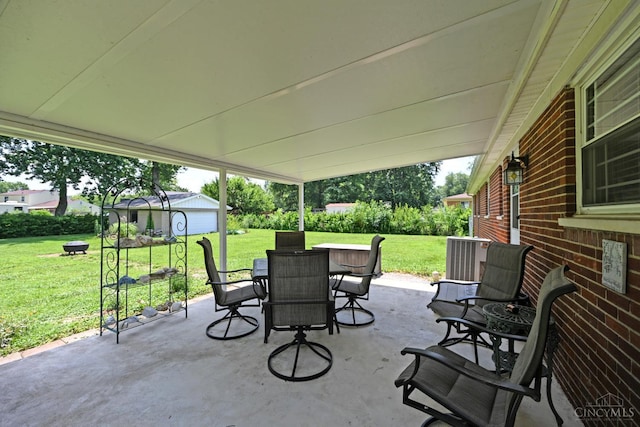 3638 El Rego Dr, Pierce Twp, OH 45102 - view of patio featuring outdoor dining area and an outbuilding
