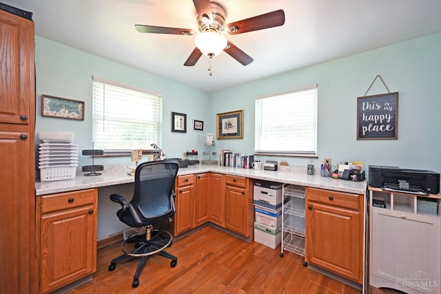 3638 El Rego Dr, Pierce Twp, OH 45102 - office area with wood finished floors, ceiling fan, and built in desk