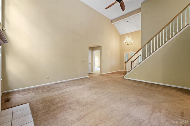 125 Sackett Dr, Monroe, OH 45050 - unfurnished living room featuring high vaulted ceiling, carpet flooring, ceiling fan, stairway, and a chandelier