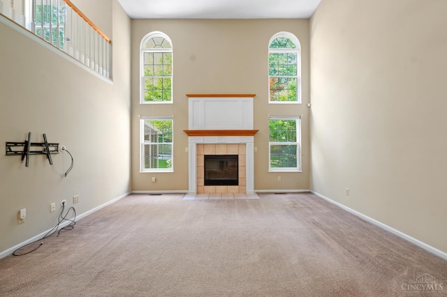 125 Sackett Dr, Monroe, OH 45050 - unfurnished living room featuring a high ceiling, carpet flooring, and a fireplace
