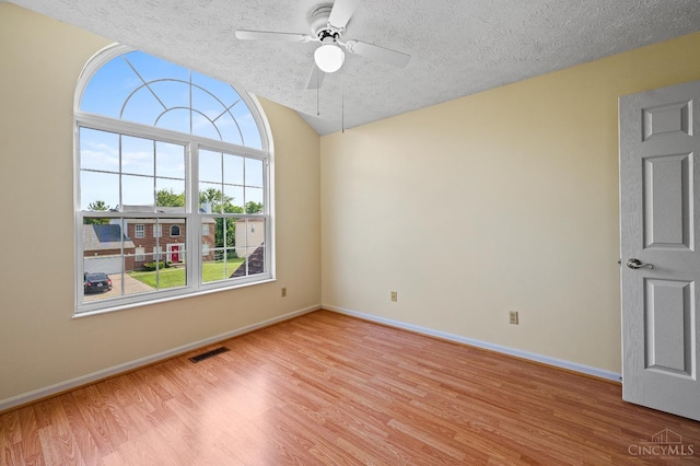 125 Sackett Dr, Monroe, OH 45050 - unfurnished room featuring light wood-type flooring, ceiling fan, a textured ceiling, and vaulted ceiling