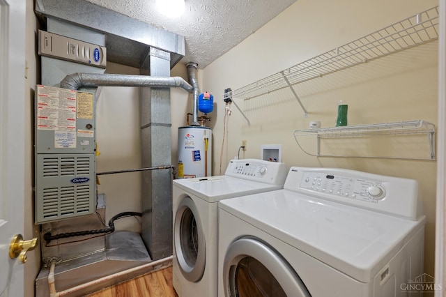 125 Sackett Dr, Monroe, OH 45050 - laundry area with water heater, wood finished floors, and separate washer and dryer