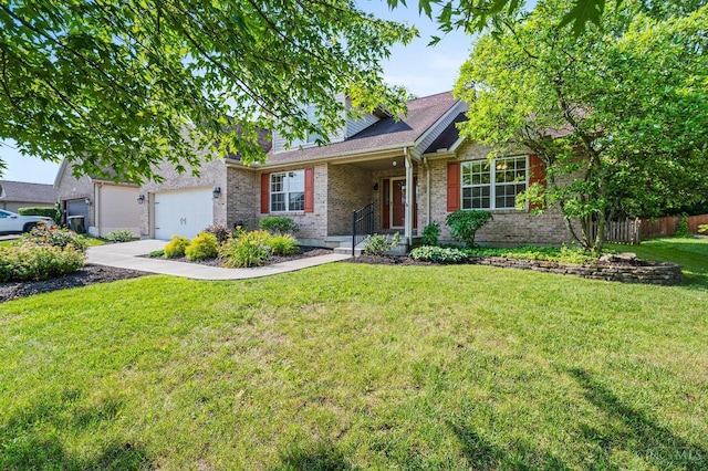 125 Sackett Dr, Monroe, OH 45050 - ranch-style house with brick siding, a garage, and concrete driveway