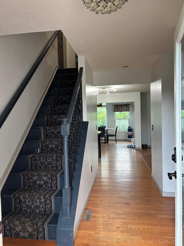 742 Miami Way Dr, Hamilton, OH 45013 - staircase featuring wood-type flooring and baseboards