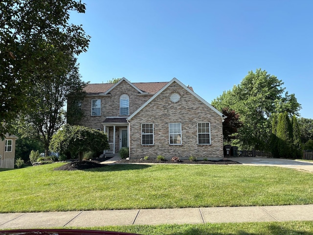 742 Miami Way Dr, Hamilton, OH 45013 - traditional-style house with a front lawn