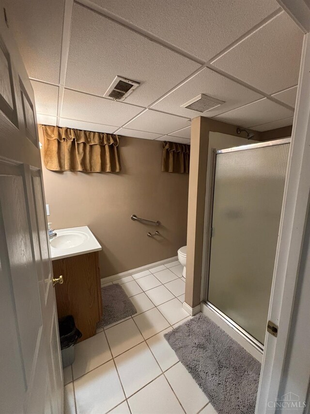 742 Miami Way Dr, Hamilton, OH 45013 - full bathroom with vanity, a stall shower, tile patterned flooring, and a drop ceiling