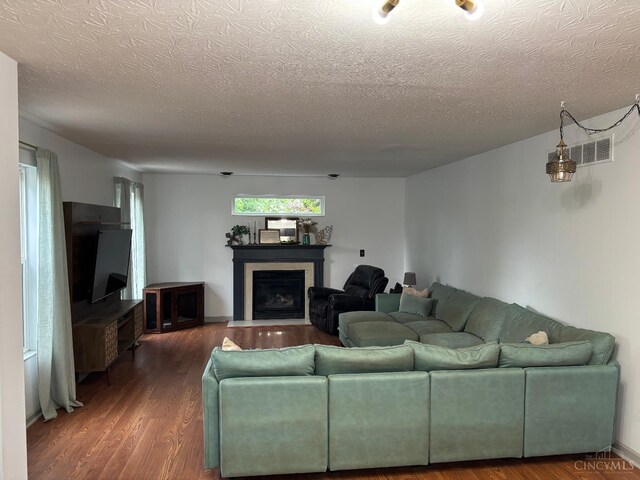 742 Miami Way Dr, Hamilton, OH 45013 - living area featuring a textured ceiling, wood finished floors, and a fireplace with flush hearth