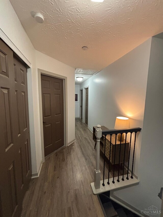 742 Miami Way Dr, Hamilton, OH 45013 - hall with wood finished floors and an upstairs landing