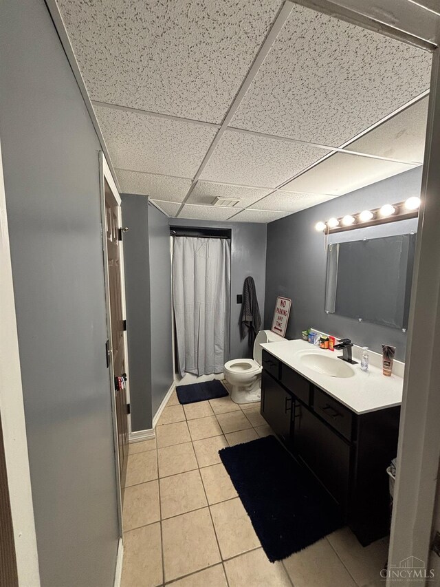 742 Miami Way Dr, Hamilton, OH 45013 - full bathroom with tile patterned flooring, vanity, curtained shower, and a drop ceiling