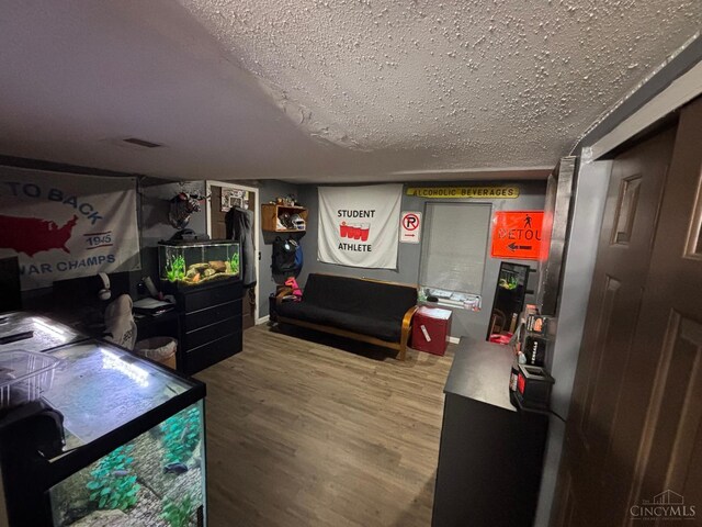 742 Miami Way Dr, Hamilton, OH 45013 - bedroom featuring wood finished floors and a textured ceiling