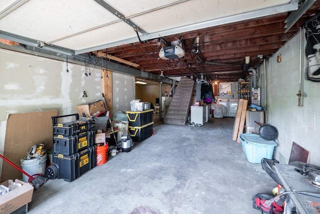 251 Westview Dr, Morrow, OH 45152 - garage with a garage door opener, washer / dryer, and concrete block wall