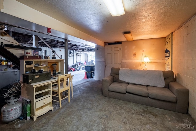 251 Westview Dr, Morrow, OH 45152 - basement featuring concrete block wall and a textured ceiling