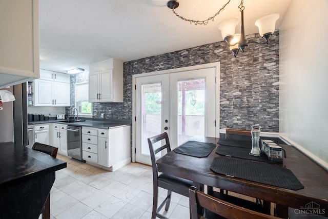 251 Westview Dr, Morrow, OH 45152 - kitchen with dishwasher, dark countertops, white cabinetry, and french doors