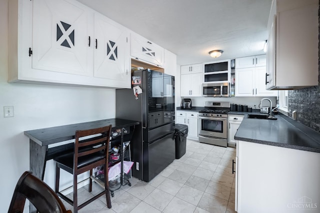251 Westview Dr, Morrow, OH 45152 - kitchen with stainless steel appliances, dark countertops, white cabinets, open shelves, and tasteful backsplash