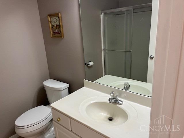 12061 Carrington Ln Unit 206, Symmes Twp, OH 45140 - bathroom featuring vanity and an enclosed shower