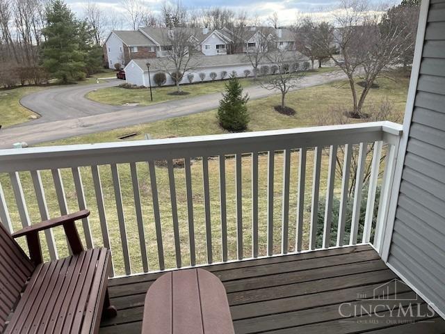 12061 Carrington Ln Unit 206, Symmes Twp, OH 45140 - wooden terrace featuring a residential view and a yard
