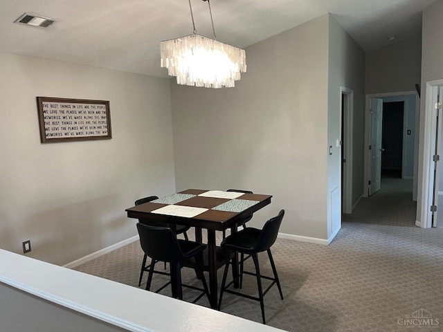 12061 Carrington Ln Unit 206, Symmes Twp, OH 45140 - carpeted dining space with a chandelier and baseboards