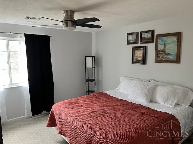 12061 Carrington Ln Unit 206, Symmes Twp, OH 45140 - bedroom featuring carpet floors and ceiling fan