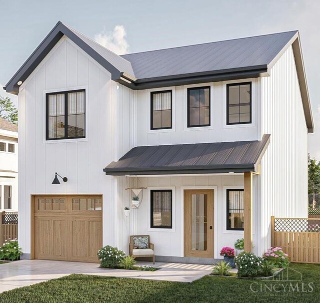 403 Elmwood Ct, Georgetown, OH 45121 - modern farmhouse with an attached garage, concrete driveway, a metal roof, and board and batten siding