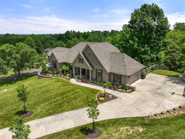 18092 Horizon Way, Lawrenceburg, IN 47025 - view of front of home featuring concrete driveway, stone siding, a front lawn, a garage, and a shingled roof