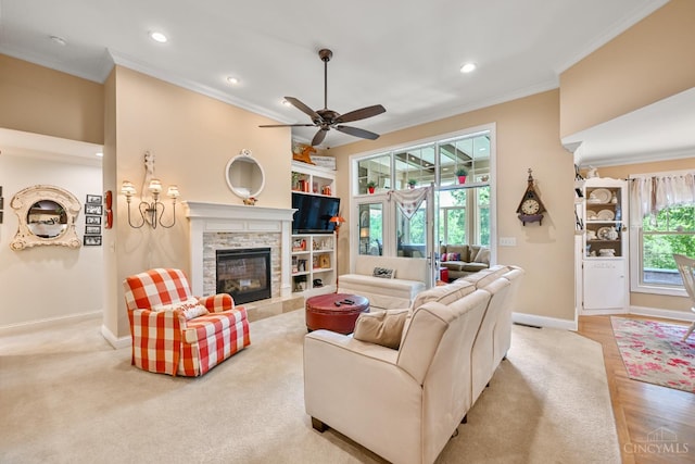 18092 Horizon Way, Lawrenceburg, IN 47025 - living room featuring crown molding, a stone fireplace, plenty of natural light, recessed lighting, and a ceiling fan