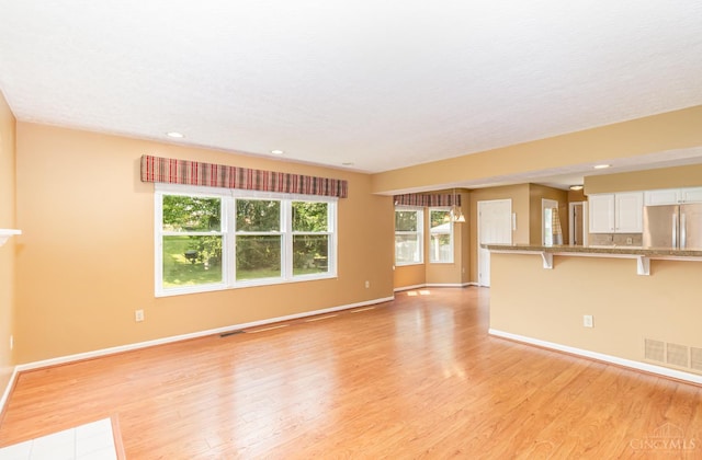 7693 Misty Springs Ct, Deerfield Twp, OH 45040 - unfurnished living room featuring light wood-style floors and recessed lighting