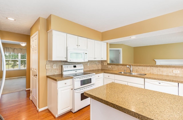 7693 Misty Springs Ct, Deerfield Twp, OH 45040 - kitchen featuring white appliances, backsplash, light wood-style floors, white cabinetry, and recessed lighting