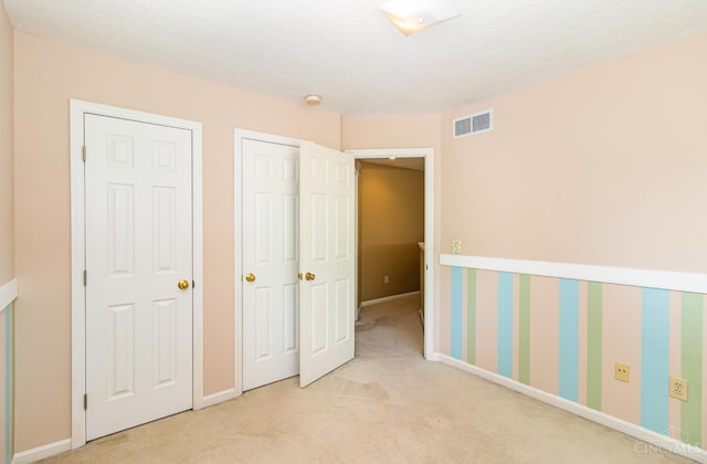 7693 Misty Springs Ct, Deerfield Twp, OH 45040 - unfurnished bedroom featuring carpet floors and a textured ceiling