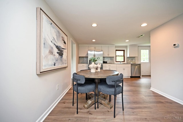 5782 Buckwheat Rd, Miami Twp, OH 45150 - dining space with recessed lighting and wood finished floors