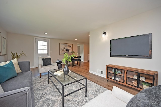 5782 Buckwheat Rd, Miami Twp, OH 45150 - living room featuring wood finished floors and recessed lighting