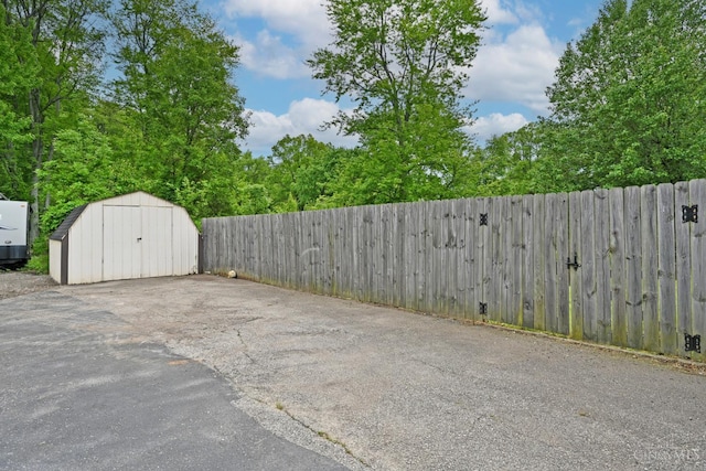 5782 Buckwheat Rd, Miami Twp, OH 45150 - view of vehicle parking featuring a shed