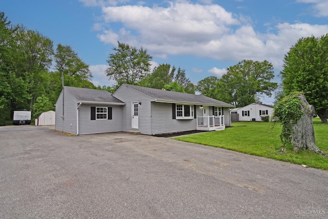 5782 Buckwheat Rd, Miami Twp, OH 45150 - ranch-style house featuring a front lawn, a porch, and asphalt driveway