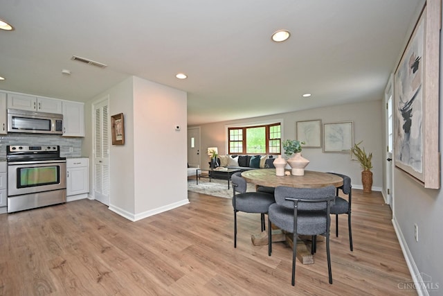 5782 Buckwheat Rd, Miami Twp, OH 45150 - dining room with light wood-type flooring and recessed lighting