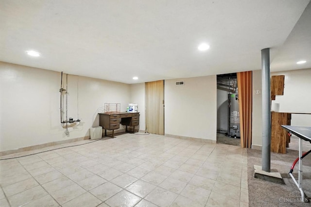 9015 Cotillion Dr, Springfield Twp, OH 45231 - finished below grade area featuring recessed lighting, gas water heater, and light tile patterned flooring