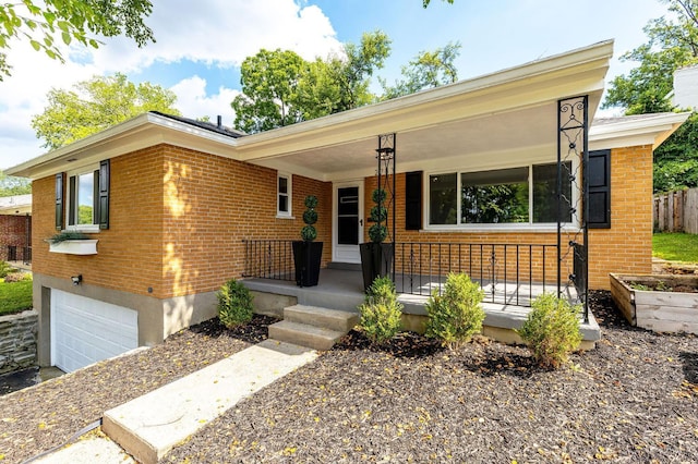 2783 Losantiridge Ave, Columbia Twp, OH 45213 - ranch-style house with a garage, covered porch, and brick siding