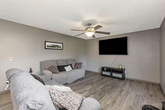 6706 Bedington Ln, Morrow, OH 45152 - living area with ceiling fan, light wood finished floors, and a textured ceiling